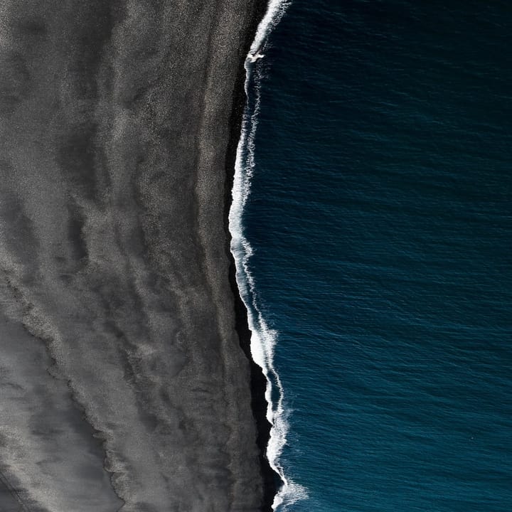 Gray and blue shoreline, Vik, Iceland. By Jeremy Bishop on Unsplash.